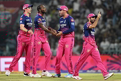 Rajasthan Royals' Jofra Archer, second left, celebrates with teammates the wicket of Lucknow Super Giants' Aiden Markram during the Indian Premier League cricket match between Lucknow Super Giants and Rajasthan Royals in Lucknow.