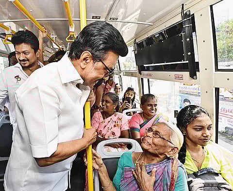 MK Stalin speaking to woman in a bus