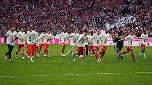 Matthias Schrader : Bayern Munich players celebrate after their team clinched the German league title after a Bundesliga match against Stuttgart in Munich.