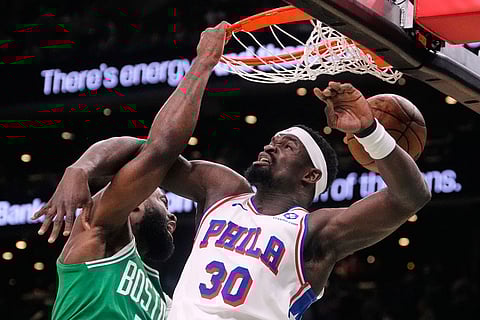 Boston Celtics guard Jaylen Brown (7) slams a dunk against Philadelphia 76ers center Adem Bona (30) during the first half of Game 2 of a first-round NBA playoffs basketball game  in Boston.