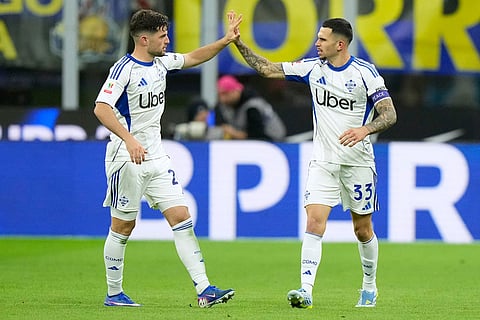 Como's Lucas Da Cunha, right, celebrates with team mate Martin Baturina after scoring his side's second goal during the Italian Cup, return-leg soccer match between Inter Milan and Como, in Milan, Italy.