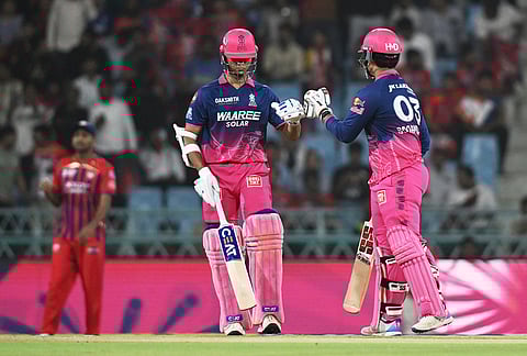 Rajasthan Royals' Vaibhav Sooryavanshi, right, and batting partner Rajasthan Royals' Yashasvi Jaiswal touch gloves before the start of the Indian Premier League cricket match between Lucknow Super Giants and Rajasthan Royals in Lucknow.