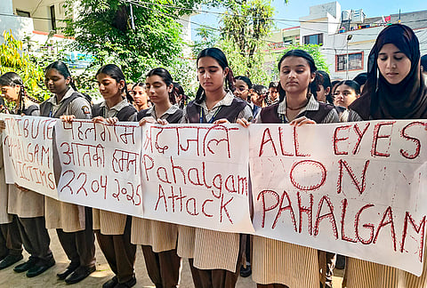 Students offer prayers and tributes to the victims of Pahalgam terror attack on its first anniversary, in Jammu.