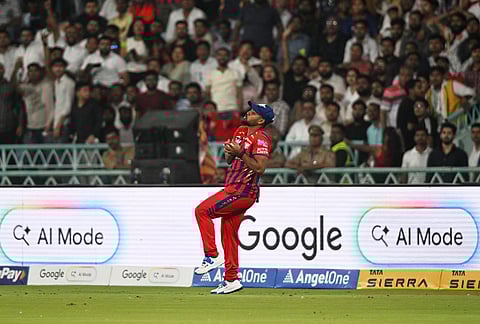 Lucknow Super Giants' Nicholas Pooran takes the catch to dismiss Rajasthan Royals' captain Riyan Parag during the Indian Premier League cricket match between Lucknow Super Giants and Rajasthan Royals in Lucknow.