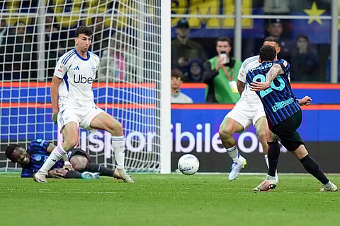 Inter Milan's Hakan Calhanoglu scores their opening goal during the Italian Cup, return-leg soccer match between Inter Milan and Como, in Milan, Italy.