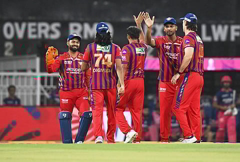 Lucknow Super Giants' Mohammed Shami, center, celebrates with teammates the wicket of Rajasthan Royals' Yashasvi Jaiswal during the Indian Premier League cricket match between Lucknow Super Giants and Rajasthan Royals in Lucknow.