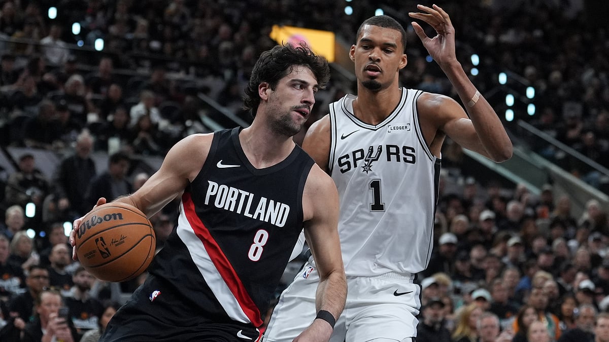 Portland Trail Blazers forward Deni Avdija (8) drives around San Antonio Spurs forward Victor Wembanyama (1) during the first half in Game 2 of a first-round. - AP/Eric Gay