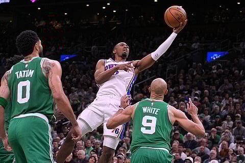 Philadelphia 76ers guard Tyrese Maxey (0) drives to the basket against the Boston Celtics during the second half of Game 2 of a first-round NBA playoffs basketball series in Boston.