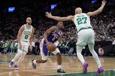 Philadelphia 76ers guard Tyrese Maxey (0) moves to net against Boston Celtics guard Jordan Walsh (27) during the second half in Game 1 of a first-round NBA playoffs basketball game in Boston.