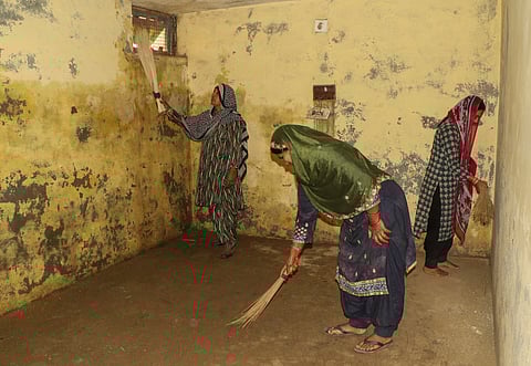 Village women clean a bunker at a village near the India - Pakistan International border in Ranbir Singh Pura, in Jammu in May 2025.