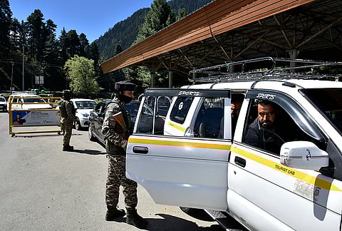 Security personnel conducting their routine check on the roadsides in Pahalgam.
