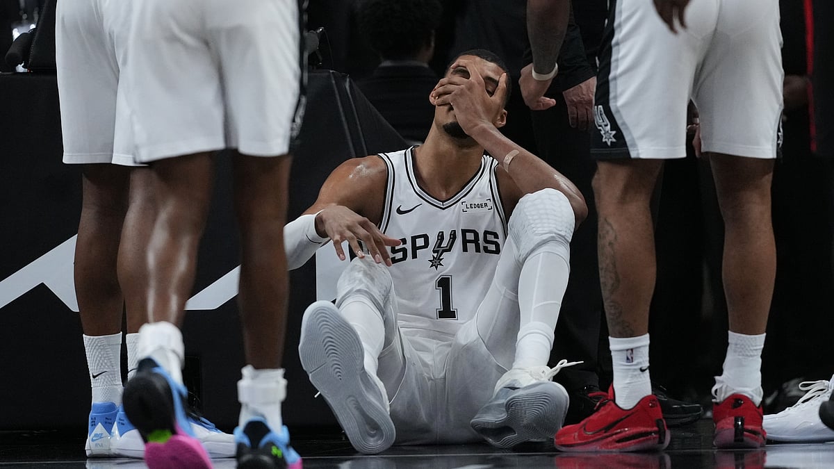 San Antonio Spurs forward Victor Wembanyama (1) sits on the court after a hard fall during the first half in Game 2 of a first-round NBA playoffs. - AP/Eric Gay