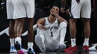 AP/Eric Gay : San Antonio Spurs forward Victor Wembanyama (1) sits on the court after a hard fall during the first half in Game 2 of a first-round NBA playoffs.