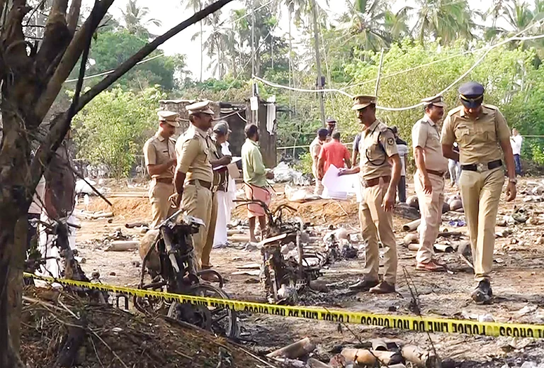 Police officials conduct a search operation after a blast at a fireworks manufacturing unit on Tuesday night, at Mundathicode in central Kerala’s Thrissur district. At least 13 people were killed and several others were injured in the incident. - | Photo: PTI