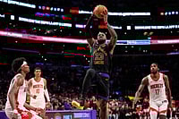 | Photo: AP/Mark J. Terrill : Los Angeles Lakers forward LeBron James, second from right, shoots as Houston Rockets guard Amen Thompson, left, forward Jabari Smith Jr., second from left, and forward Tari Eason defend during the second half in Game 2 of a first-round NBA playoffs basketball series in Los Angeles.