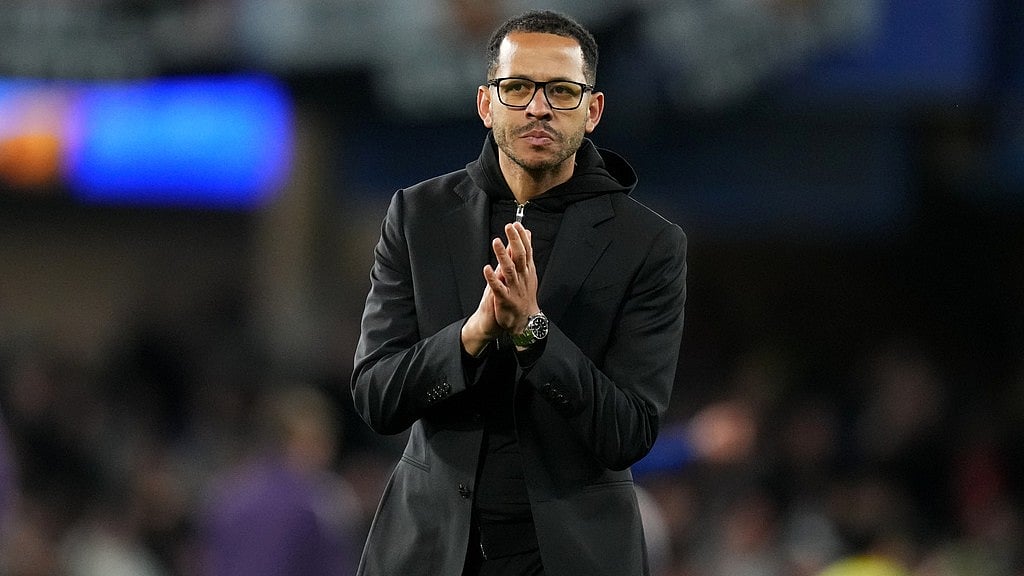 Chelsea head coach Liam Rosenior leaves the field after the English Premier League match between Chelsea and Manchester United in London. - AP/Kirsty Wigglesworth