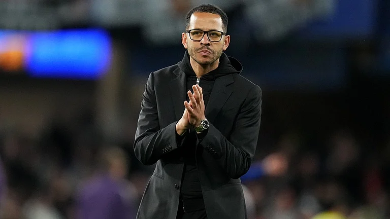 Chelsea head coach Liam Rosenior leaves the field after the English Premier League match between Chelsea and Manchester United in London. - AP/Kirsty Wigglesworth