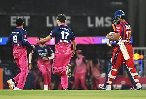 Rajasthan Royals' Nandre Burger, center right, celebrates the wicket of Lucknow Super Giants' captain Rishabh Pant, right, during the Indian Premier League cricket match between Lucknow Super Giants and Rajasthan Royals in Lucknow.
