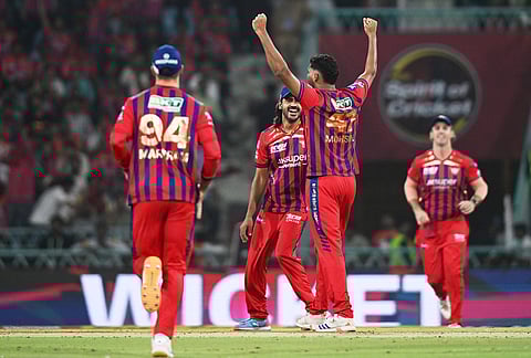 Lucknow Super Giants' Mohsin Khan, second right, celebrates with teammates the wicket of Rajasthan Royals' Shimron Hetmyer during the Indian Premier League cricket match between Lucknow Super Giants and Rajasthan Royals in Lucknow.