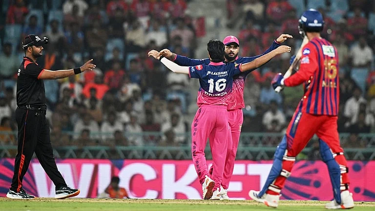 Rajasthan Royals' Brijesh Sharma, center, back to the camera, celebrates with captain Riyan Parag the wicket of Lucknow Super Giants' Mukul Choudhary, right, during the Indian Premier League cricket match between Lucknow Super Giants and Rajasthan Royals in Lucknow. - | Photo: AP