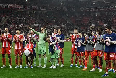 Bayern's goalkeeper Manuel Neuer celebrates with team mates after the German Soccer Cup semifinal match between Bayer Leverkusen and Bayern Munich in Leverkusen, Germany.
