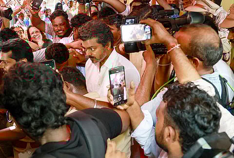 Tamilaga Vettri Kazhagam (TVK) chief and candidate from the Tiruchirappalli East constituency, Vijay, casts a vote in the Tamil Nadu Assembly elections at a polling station in Chennai.