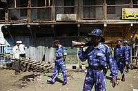 PTI : September 2008, Malegaon Shopkeeper monitoring losses property commandoes with Action Force keeping vigil after the bomb blast on 29th
