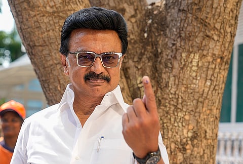 Tamil Nadu Chief Minister and DMK candidate from Kolathur constituency, MK Stalin, shows his ink-marked finger after casting a vote in the state Assembly elections, at a polling station, in Chennai.