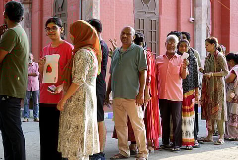People standing in queue to vote during the 2026 Tamil Nadu Assembly elections, at polling booth in Egmore.