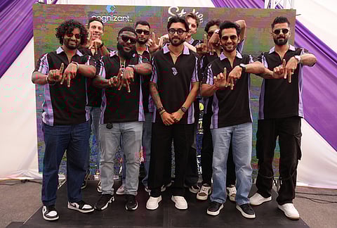 Members of the Los Angeles Knight Riders, cricket team form a LA sign with their hands as they pose for a picture at the Pomona Fairplex during the groundbreaking ceremony of the new Knight Riders Cricket Field, which will serve as the Los Angeles Knight Riders' official home field for 2026 and later host cricket at the LA 2028 Olympics. 