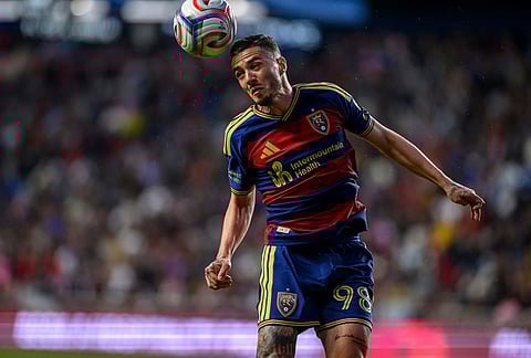 Real Salt Lake defender Alexandros Katranis heads the ball away from the net during an MLS soccer match against Inter Miami, in Sandy, Utah. 