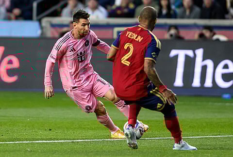 Inter Miami midfielder Lionel Messi, left, controls the ball defended by Real Salt Lake defender DeAndre Yedlin during an MLS soccer match, in Sandy, Utah.