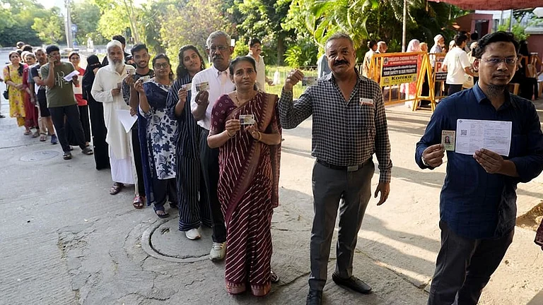 Voters show their voter ID cards before casting their votes at one of the polling stations in Egmore, during the Tamil Nadu Assembly elections 2026 - | Photo: Suresh K Pandey/Outlook