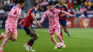 AP : Inter Miami midfielder Lionel Messi (10) controls the ball as he works through the defense of Real Salt Lake defender Alexandros Katranis, center left.