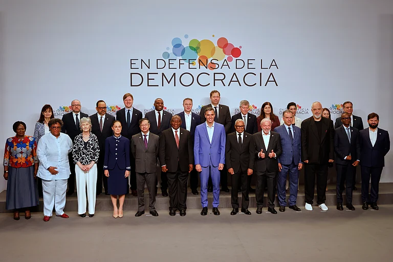 Spain's Prime Minister Pedro Sanchez, center, poses with attendees at the Meeting in Defence of Democracy summit in Barcelona, Spain, Saturday, April 18, 2026. - Joan Monfort