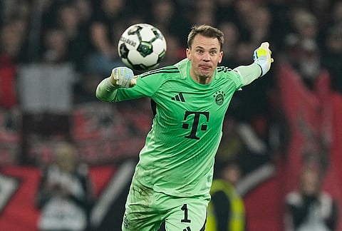 Bayern's goalkeeper Manuel Neuer heads the ball during the German Soccer Cup semifinal match between Bayer Leverkusen and Bayern Munich in Leverkusen, Germany.