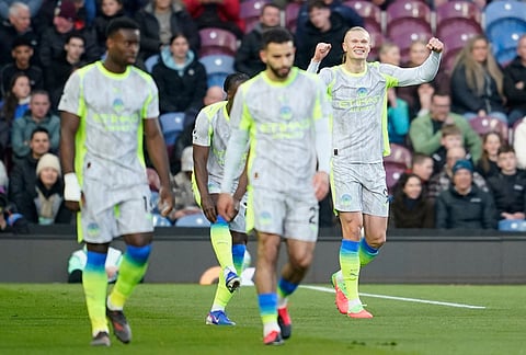 Manchester City's Erling Haaland celebrates after scoring during the Premier League soccer match between Burnley and Manchester City in Burnley, England.