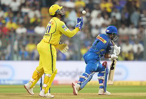 Chennai Super Kings' Sanju Samson successfully takes the catch of Mumbai Indian's Danish Malewar during the Indian Premier League cricket match between Mumbai Indians and Chennai Super Kings in Mumbai.