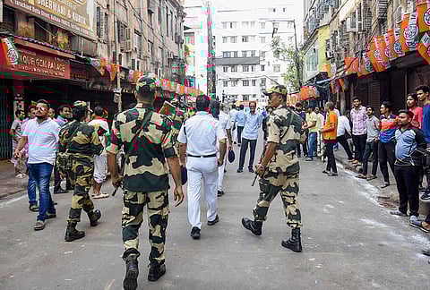 Central paramilitary forces conduct a march-past amid tight security arrangements across various Assembly constituencies during election campaigns and rallies ahead of the West Bengal Assembly elections, in Kolkata.