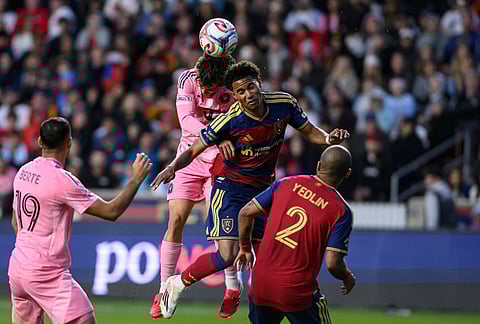 Real Salt Lake midfielder Zavier Gozo, center right, heads the ball away from Inter Miami defender Sergio Reguilón, center left, during an MLS soccer match, in Sandy, Utah. 