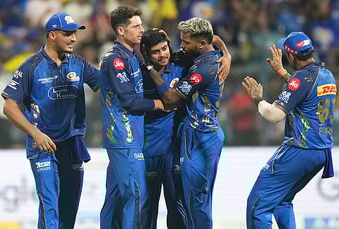 Mumbai Indians' Ashwani Kumar, centre, celebrates with teammates the wicket of Chennai Super Kings' Dewald Brevis during the Indian Premier League cricket match between Mumbai Indians and Chennai Super Kings in Mumbai.