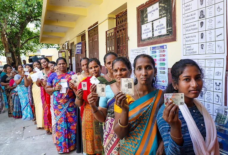 Women show their identity cards as they queue to vote at a polling station during the Tamil Nadu Assembly elections, in Chennai, Thursday, April 23, 2026. - PTI