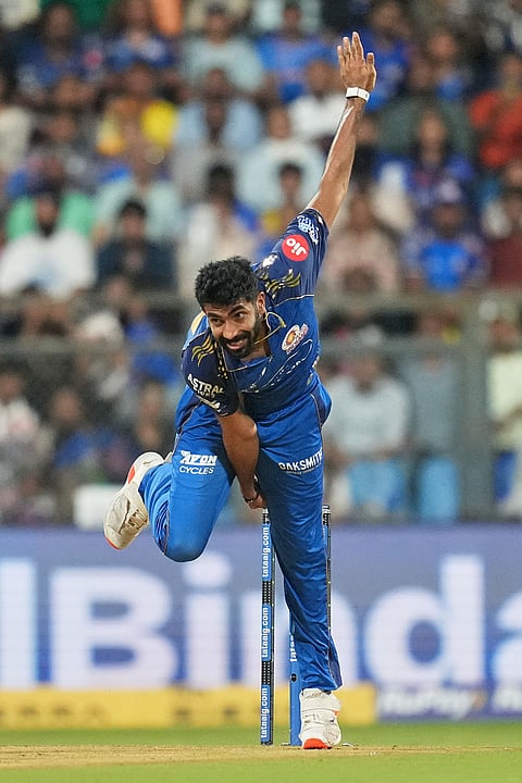 Mumbai Indians' Jasprit Bumrah bowls a delivery during the Indian Premier League cricket match between Mumbai Indians and Chennai Super Kings in Mumbai. 