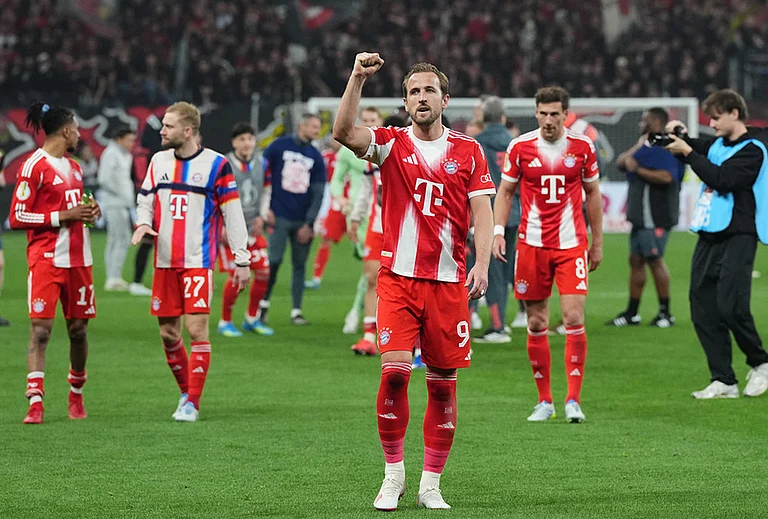 Bayern's Harry Kane celebrates after the German Soccer Cup semifinal match between Bayer Leverkusen and Bayern Munich in Leverkusen, Germany. - | Photo: AP/Martin Meissner