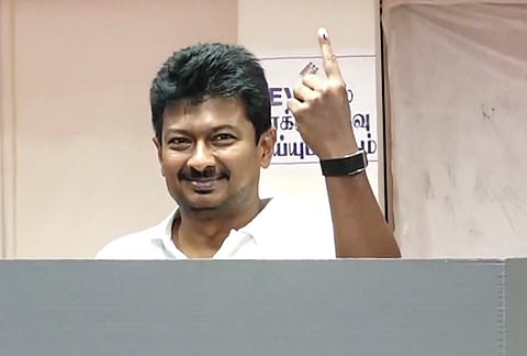 Tamil Nadu Deputy Chief Minister and DMK candidate from Chepauk-Thiruvallikeni constituency, Udhayanidhi Stalin, shows his ink-marked finger after casting a vote in the state Assembly elections, at a polling station, in Chennai.