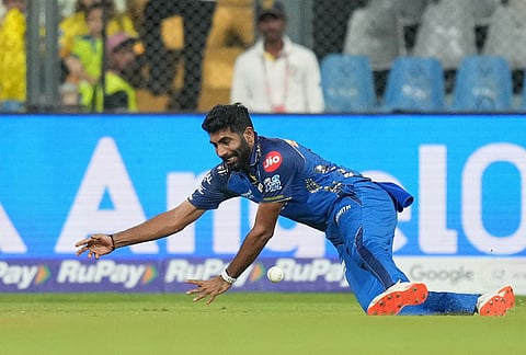 Mumbai Indians' Jasprit Bumrah fields the ball during the Indian Premier League cricket match between Mumbai Indians and Chennai Super Kings in Mumbai.