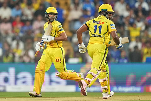Chennai Super Kings' captain Ruturaj Gaikwad, left, and Sanju Samson run between the wickets during the Indian Premier League cricket match between Mumbai Indians and Chennai Super Kings in Mumbai.