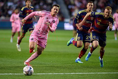 Inter Miami forward Tadeo Allende, left, and Real Salt Lake defender Justen Glad, right, run to possess the ball during an MLS soccer match, in Sandy, Utah.