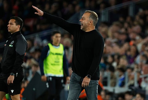 Barcelona's head coach Hansi Flick gestures during the Spanish La Liga soccer match between Barcelona and Celta Vigo in Barcelona, Spain.