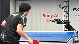 (Sony AI via AP) : A table tennis robot built by Sony maneuvers to hit the ball back to its human opponent, Akito Saeki, during a match in Tokyo, Dec. 2025.
